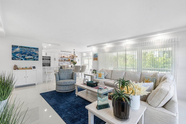 875 E Camino Real Unit 3E, Boca Raton, FL 33432 - living area featuring light marble finish flooring and a chandelier