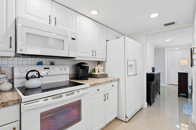 899 Jeffery St Unit 301, Boca Raton, FL 33487 - kitchen with white appliances, decorative backsplash, white cabinets, and recessed lighting