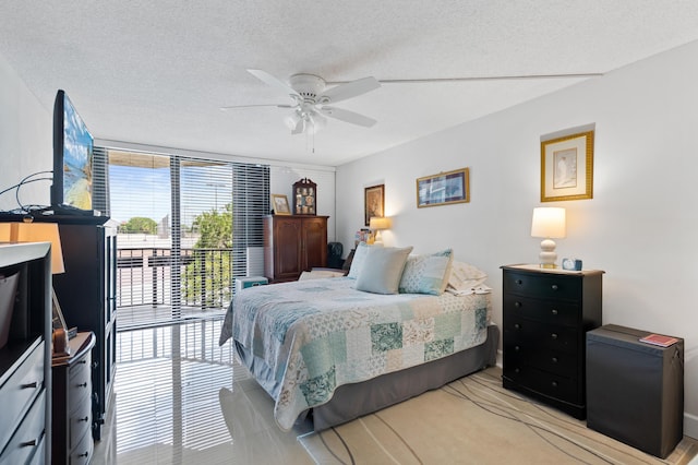 899 Jeffery St Unit 301, Boca Raton, FL 33487 - bedroom with ceiling fan and a textured ceiling