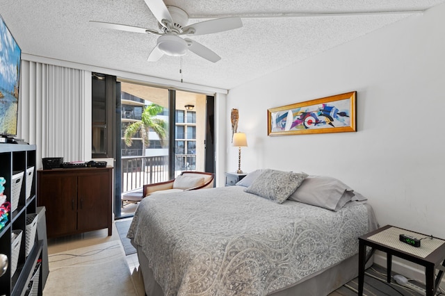 899 Jeffery St Unit 301, Boca Raton, FL 33487 - bedroom featuring access to outside, a textured ceiling, floor to ceiling windows, and a ceiling fan