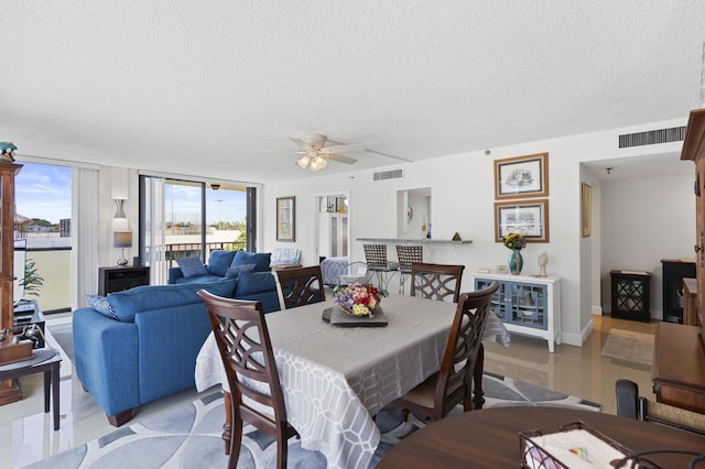 899 Jeffery St Unit 301, Boca Raton, FL 33487 - dining room with a textured ceiling, a ceiling fan, and baseboards