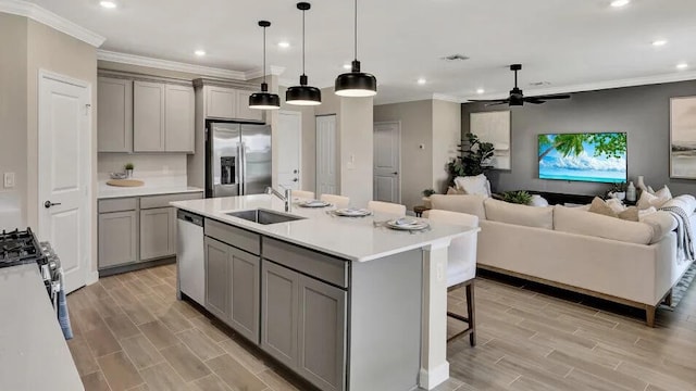 1681 Whistlegrass Ln, Loxahatchee, FL 33470 - kitchen featuring gray cabinetry, appliances with stainless steel finishes, a sink, recessed lighting, and wood finish floors