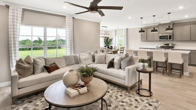 1681 Whistlegrass Ln, Loxahatchee, FL 33470 - living area featuring a ceiling fan, recessed lighting, light wood-style floors, and a chandelier