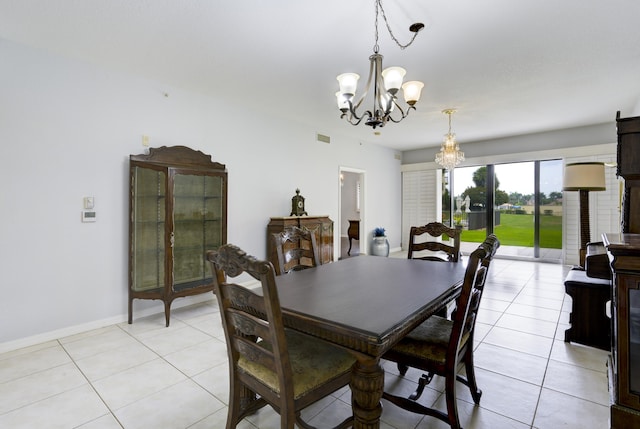 370 Golfview Rd Unit 103, North Palm Beach, FL 33408 - dining area with a chandelier and light tile patterned floors