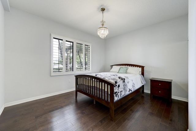 370 Golfview Rd Unit 103, North Palm Beach, FL 33408 - bedroom featuring hardwood / wood-style floors and a chandelier