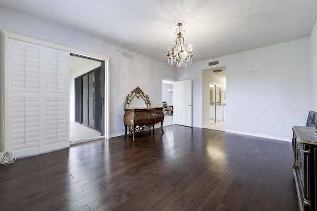370 Golfview Rd Unit 103, North Palm Beach, FL 33408 - dining area with a chandelier and dark wood finished floors