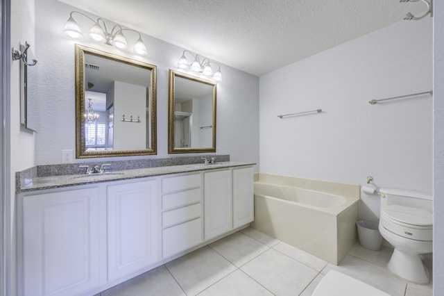 370 Golfview Rd Unit 103, North Palm Beach, FL 33408 - full bathroom with a textured ceiling, double vanity, a garden tub, and tile patterned flooring