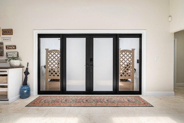 2626 NW 42nd St, Boca Raton, FL 33434 - view of exterior entry with french doors and stucco siding