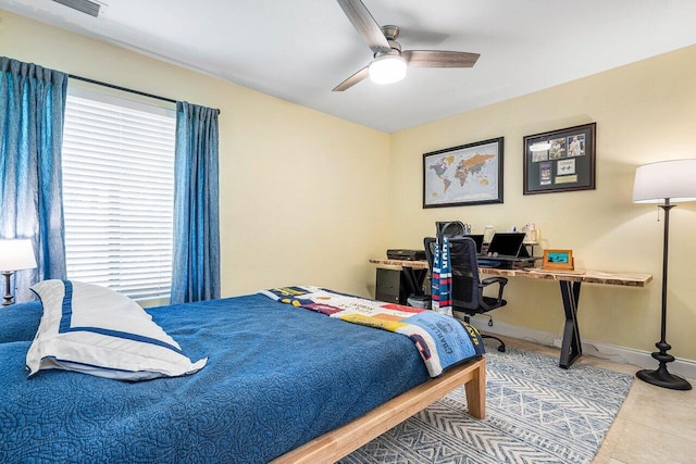2626 NW 42nd St, Boca Raton, FL 33434 - bedroom featuring an office area, a ceiling fan, baseboards, and tile patterned flooring