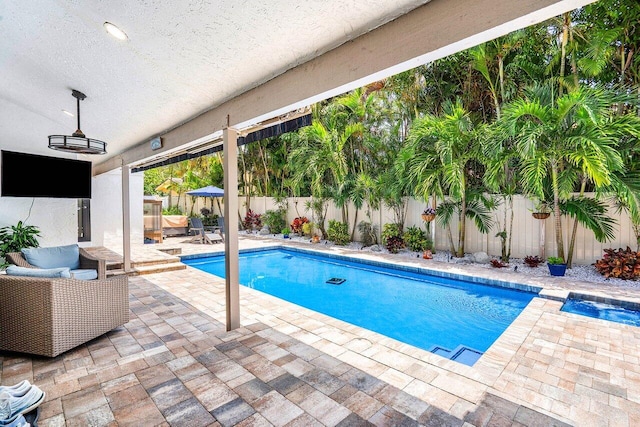 2626 NW 42nd St, Boca Raton, FL 33434 - view of pool with a patio, a fenced backyard, and an outdoor living space