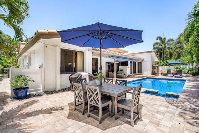 2626 NW 42nd St, Boca Raton, FL 33434 - view of swimming pool with outdoor dining space, a patio, a grill, and an outdoor living space