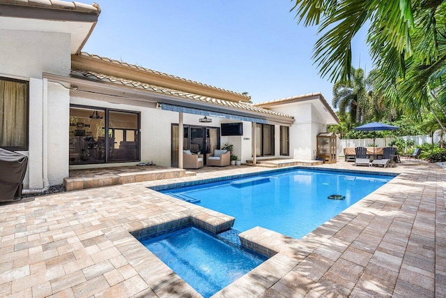 2626 NW 42nd St, Boca Raton, FL 33434 - view of swimming pool with outdoor lounge area, a patio, and a pool with connected hot tub
