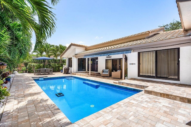 2626 NW 42nd St, Boca Raton, FL 33434 - outdoor pool featuring a patio, an outdoor living space, and outdoor dining space