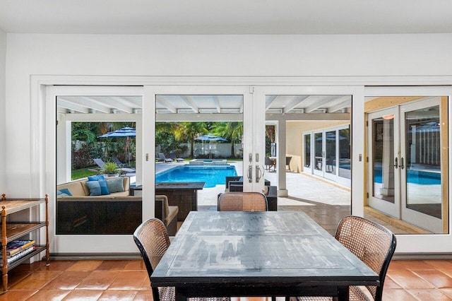 310 NW 18th St, Delray Beach, FL 33444 - dining area with french doors and light tile patterned floors