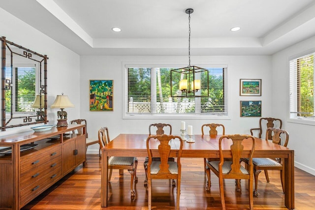 310 NW 18th St, Delray Beach, FL 33444 - dining space featuring a tray ceiling, dark wood-style floors, baseboards, a chandelier, and recessed lighting