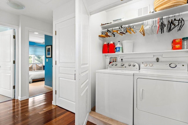 310 NW 18th St, Delray Beach, FL 33444 - washroom featuring washer and clothes dryer and wood finished floors