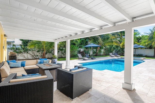 310 NW 18th St, Delray Beach, FL 33444 - view of swimming pool featuring a patio area, a fenced backyard, an outdoor living space with a fire pit, and a pool with connected hot tub