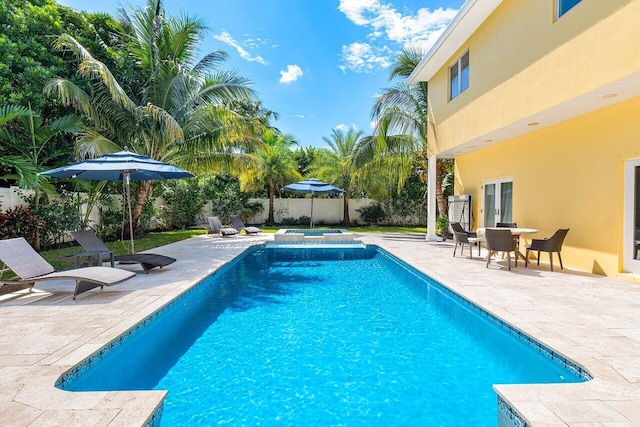310 NW 18th St, Delray Beach, FL 33444 - view of swimming pool with a patio and a fenced backyard