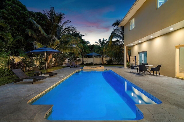 310 NW 18th St, Delray Beach, FL 33444 - view of pool with an in-ground hot tub, a patio, and a fenced backyard