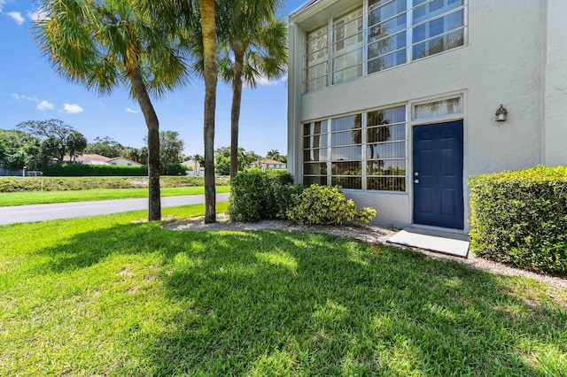 2860 SW 22nd Ave Unit 4170, Delray Beach, FL 33445 - entrance to property featuring stucco siding and a yard