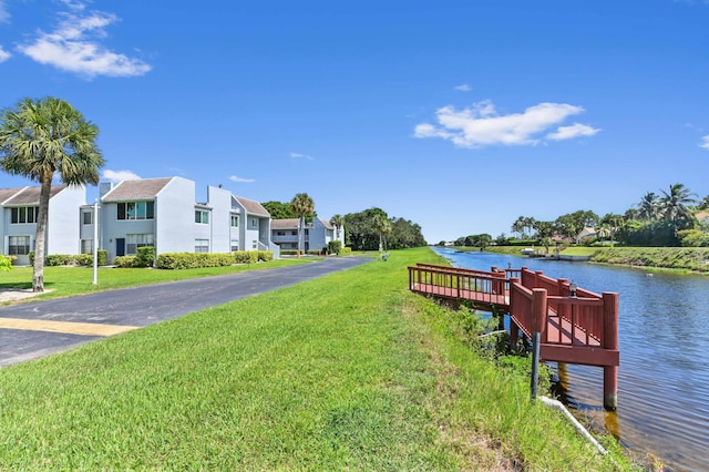 2860 SW 22nd Ave Unit 4170, Delray Beach, FL 33445 - dock area with a yard, a water view, and a residential view