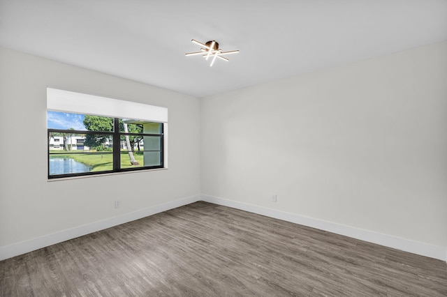 2517 S 17th St Unit 102, Fort Pierce, FL 34982 - spare room with wood finished floors and baseboards