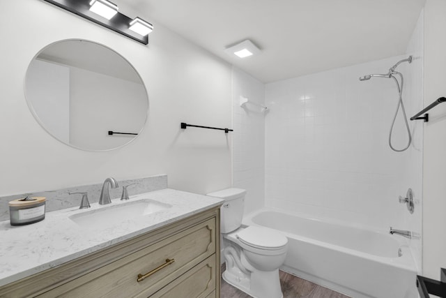 2517 S 17th St Unit 102, Fort Pierce, FL 34982 - bathroom featuring vanity, wood finished floors, toilet, and bathtub / shower combination