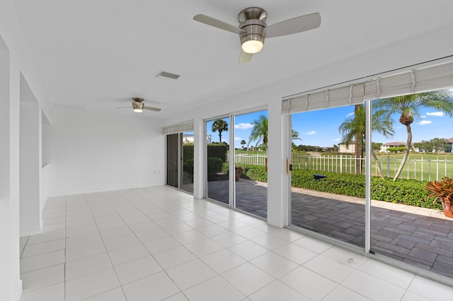 1415 Bear Island Dr, West Palm Beach, FL 33409 - spare room with a ceiling fan and light tile patterned floors