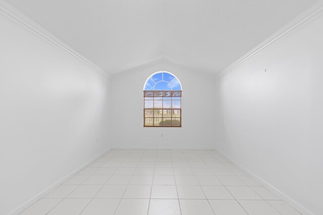 1415 Bear Island Dr, West Palm Beach, FL 33409 - spare room featuring lofted ceiling and ornamental molding
