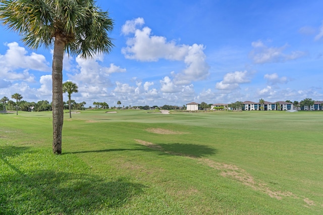 1415 Bear Island Dr, West Palm Beach, FL 33409 - view of home's community with golf course view and a yard