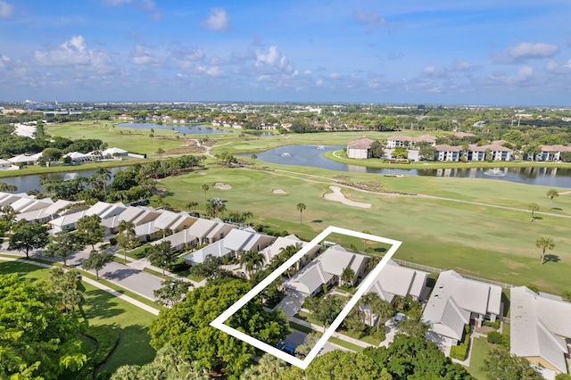 1415 Bear Island Dr, West Palm Beach, FL 33409 - aerial view of residential area featuring property boundaries highlighted, a large body of water, and a golf club