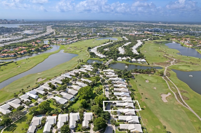 1415 Bear Island Dr, West Palm Beach, FL 33409 - aerial view of property's location featuring a golf course, nearby suburban area, and a nearby body of water