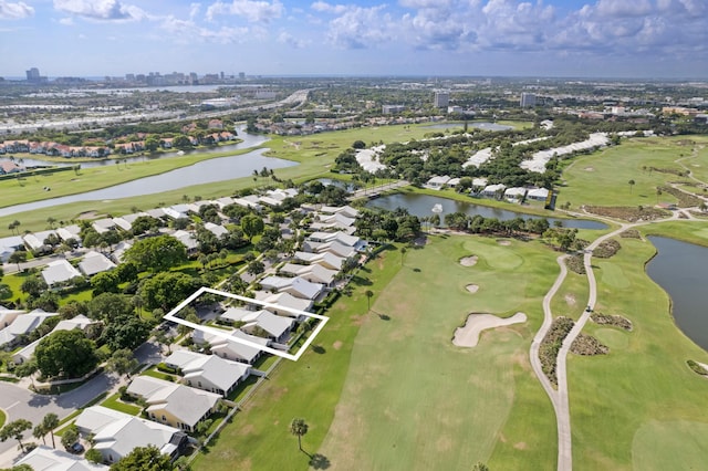 1415 Bear Island Dr, West Palm Beach, FL 33409 - aerial overview of property's location with a nearby body of water, nearby suburban area, and a golf course