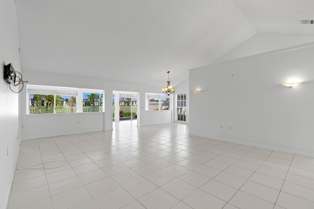 1415 Bear Island Dr, West Palm Beach, FL 33409 - unfurnished living room featuring lofted ceiling, a chandelier, and light tile patterned floors