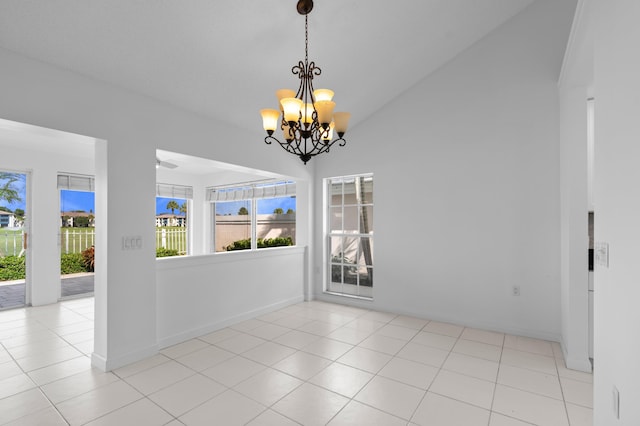 1415 Bear Island Dr, West Palm Beach, FL 33409 - unfurnished room featuring vaulted ceiling, a chandelier, and baseboards