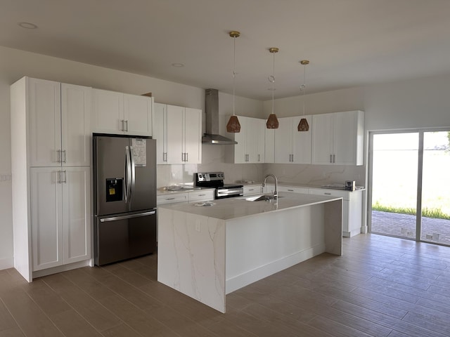 4641 Northview Dr, Jupiter, FL 33458 - kitchen featuring stainless steel appliances, wall chimney exhaust hood, dark wood-style flooring, and white cabinetry