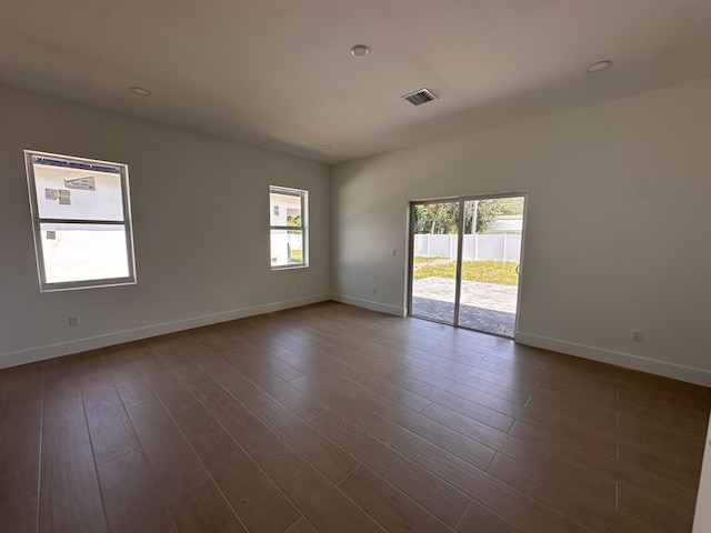 4641 Northview Dr, Jupiter, FL 33458 - spare room featuring healthy amount of natural light and dark wood-style flooring