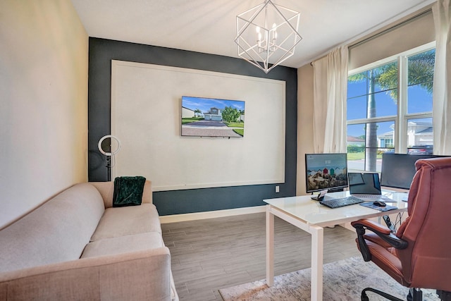 12623 NW Copper Creek Dr, Port Saint Lucie, FL 34987 - office space featuring wood finished floors, a chandelier, and baseboards