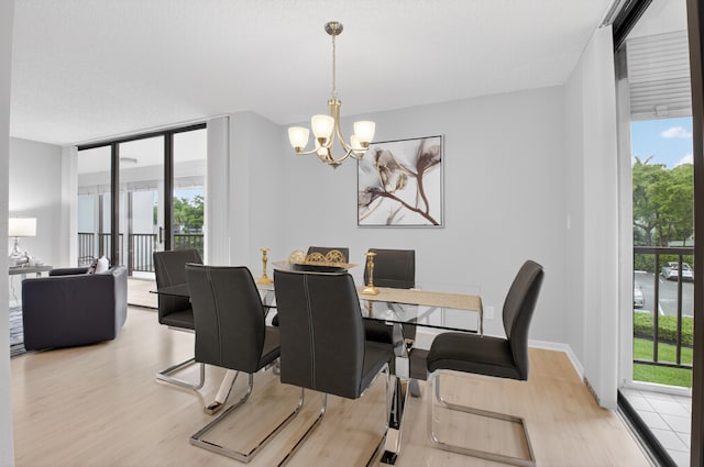 6815 Willow Wood Dr Unit 4022, Boca Raton, FL 33434 - dining area with wood finished floors, plenty of natural light, and a chandelier
