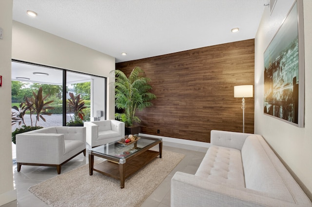 6815 Willow Wood Dr Unit 4022, Boca Raton, FL 33434 - living room with wood walls, an accent wall, and recessed lighting