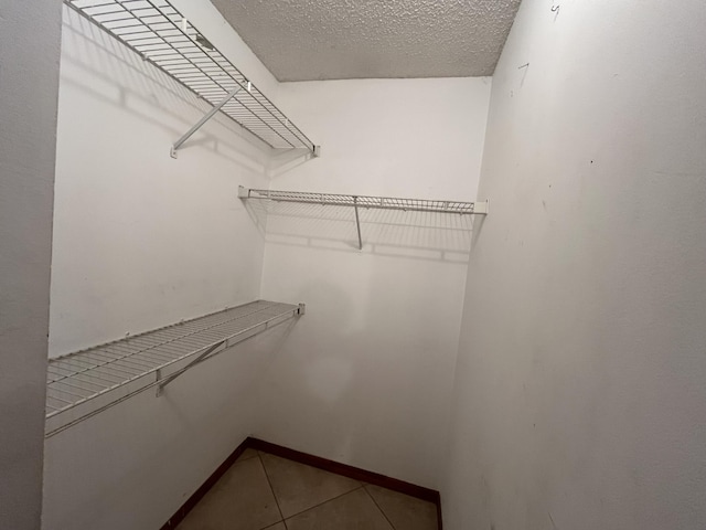 2955 SW Varsity Ln, Port Saint Lucie, FL 34953 - spacious closet with tile patterned floors