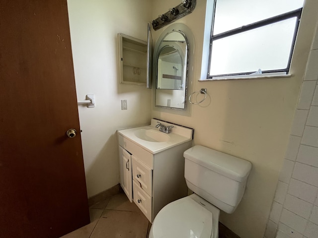 2955 SW Varsity Ln, Port Saint Lucie, FL 34953 - bathroom with vanity, toilet, and tile patterned floors