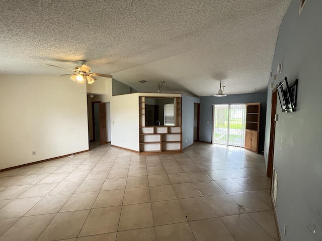 2955 SW Varsity Ln, Port Saint Lucie, FL 34953 - spare room featuring lofted ceiling, a textured ceiling, baseboards, light tile patterned floors, and ceiling fan
