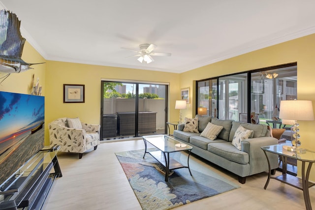 3209 S Lakeview Cir Unit 8-101, Hutchinson Island, FL 34949 - living room featuring crown molding, wood finished floors, and ceiling fan