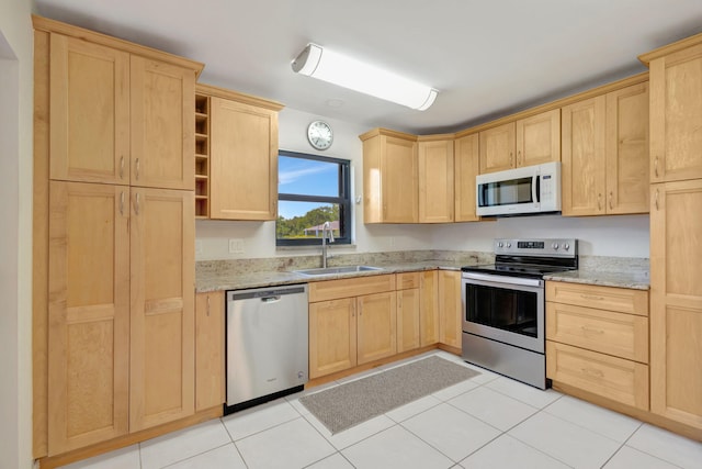 3209 S Lakeview Cir Unit 8-101, Hutchinson Island, FL 34949 - kitchen featuring stainless steel appliances, light brown cabinetry, light stone countertops, and open shelves