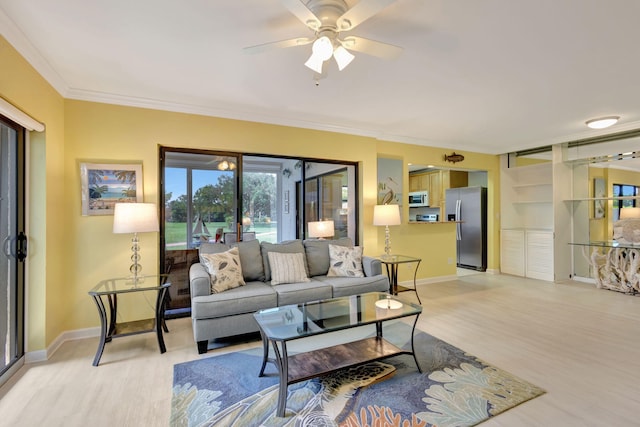 3209 S Lakeview Cir Unit 8-101, Hutchinson Island, FL 34949 - living area featuring light wood-style flooring, crown molding, and a ceiling fan