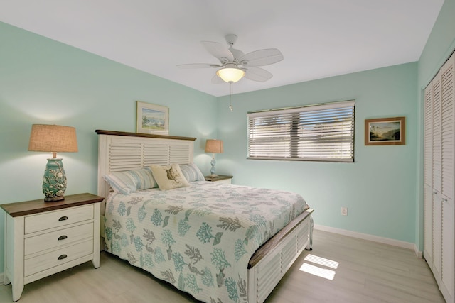 3209 S Lakeview Cir Unit 8-101, Hutchinson Island, FL 34949 - bedroom featuring a closet, light wood finished floors, and a ceiling fan