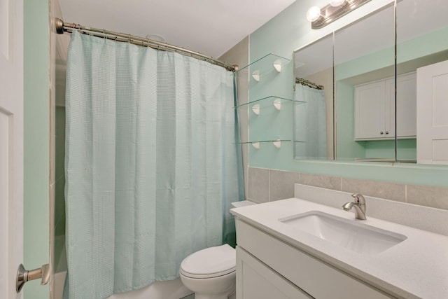 3209 S Lakeview Cir Unit 8-101, Hutchinson Island, FL 34949 - bathroom with vanity, shower / bath combo with shower curtain, and tile walls