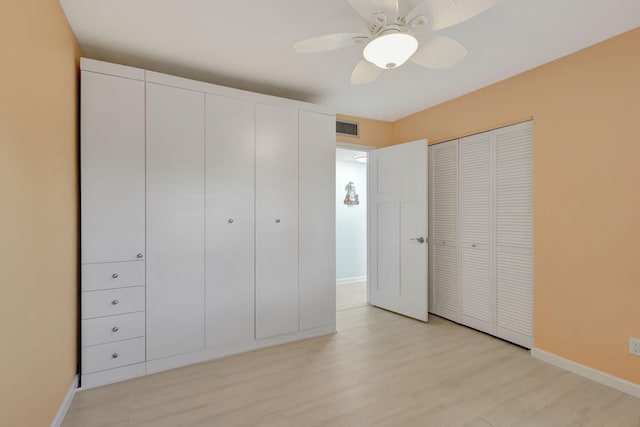 3209 S Lakeview Cir Unit 8-101, Hutchinson Island, FL 34949 - unfurnished bedroom featuring a ceiling fan and light wood finished floors