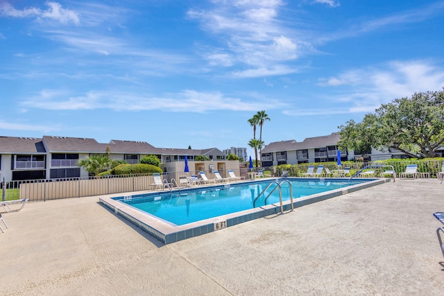 3209 S Lakeview Cir Unit 8-101, Hutchinson Island, FL 34949 - community pool featuring a patio and a residential view